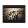 Tranquil dock leads toward a dramatic foggy horizon,  moody yet peaceful atmosphere.